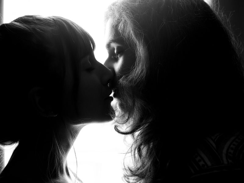 two women kissing and lap dance