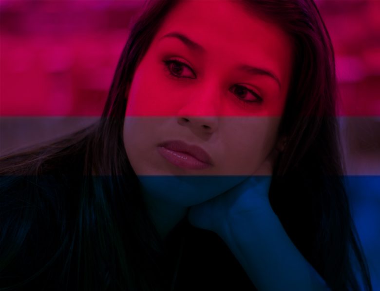 Woman's face looking thoughtful with bi flag colors imposed on top