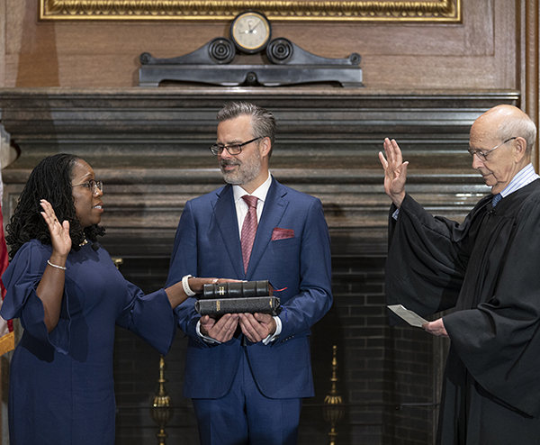 Justice Stephen G. Breyer (Retired) administers the Judicial Oath to Judge Ketanji Brown Jackson in the West Conference Room, Supreme Court Building. Dr. Patrick Jackson holds the Bible. Credit: Fred Schilling, Collection of the Supreme Court of the United States.