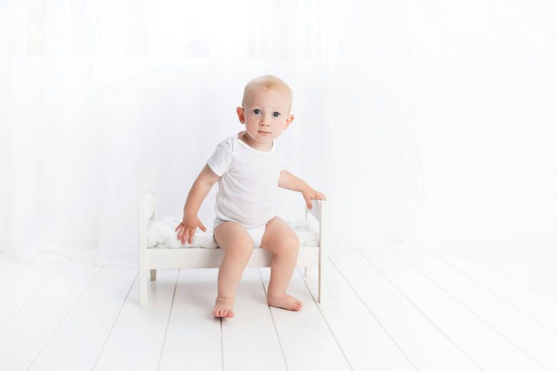 mayim bialik potty training photo of white baby on a toilet