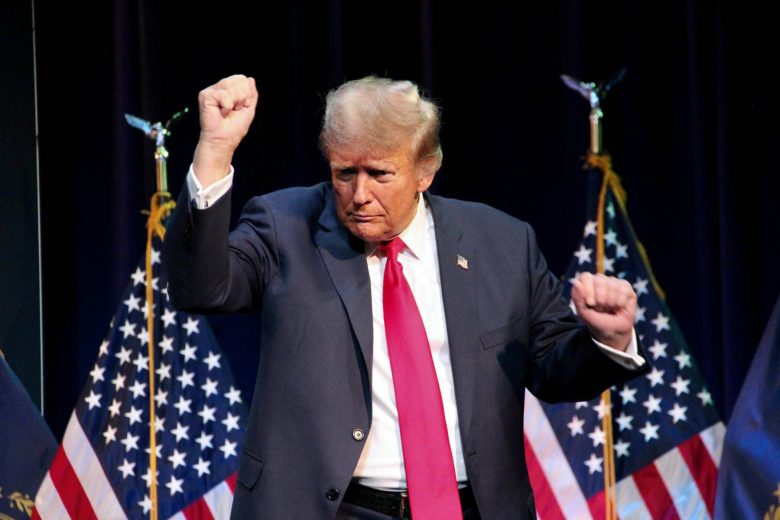 Former President Donald Trump maybe dancing in front of American Flags