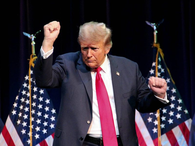 Former President Donald Trump maybe dancing in front of American Flags